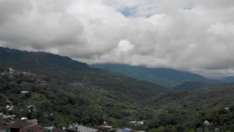 4k-Aerial-Panning-shot-of-Kohima-city-covered-in-Fog,-Nagaland,-India