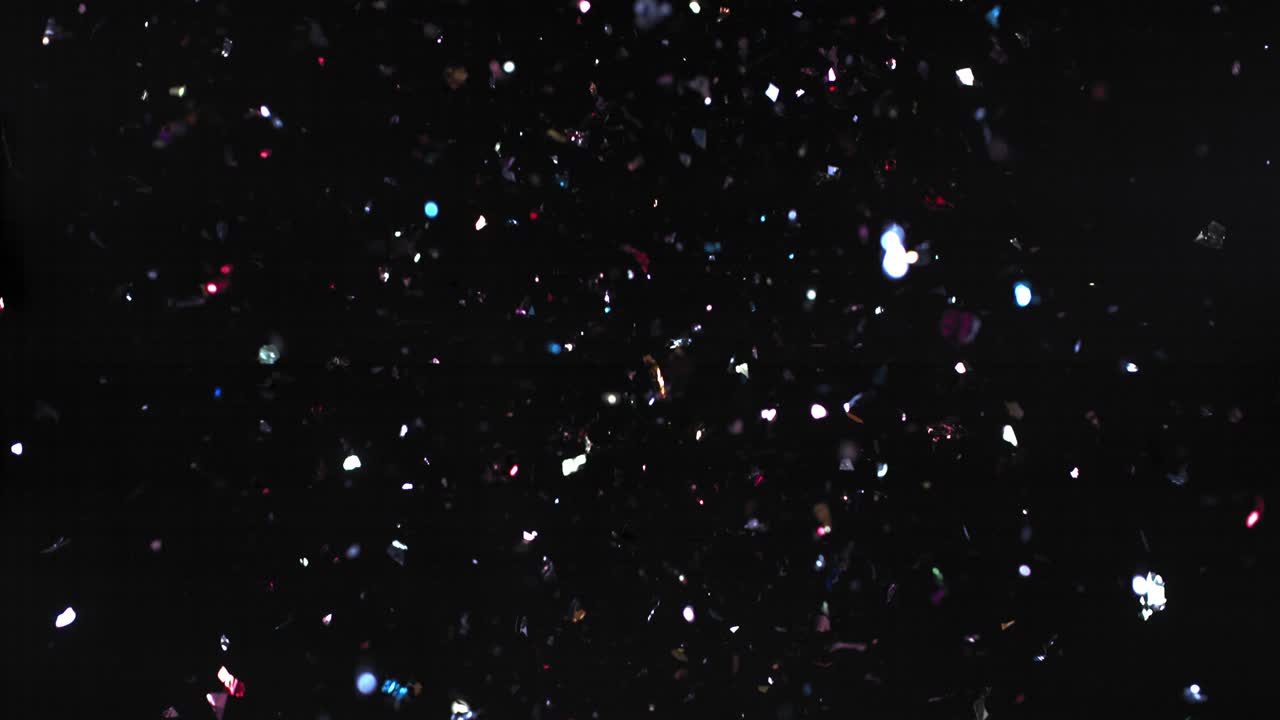 검은색 배경 에 있는 다채로운 콘페티