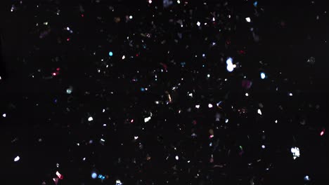 colorful confetti on black background