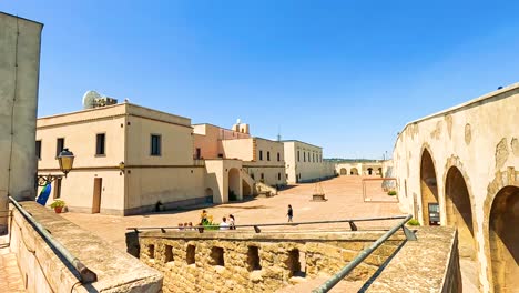 people walking around a historic site in naples