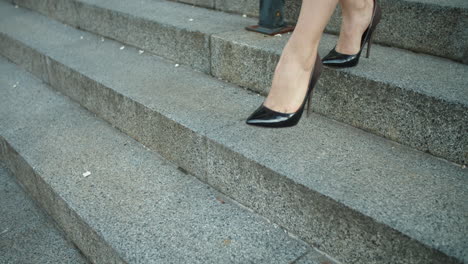 woman entrepreneur wearing stylish shoes outside