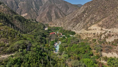 tolantongo mexico aerial v11 spectacular view low level drone flyover reveals canyon hot springs and nature oasis riverside camping sites and resorts - shot with mavic 3 cine - december 2021