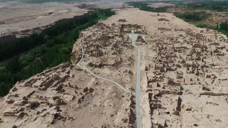 aerial drone view of jiaohe ruins, ancient silk road city in turpan, xinjiang, natural landscape and off road beaten path