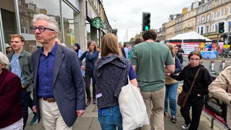 crowds walking along a busy festival street