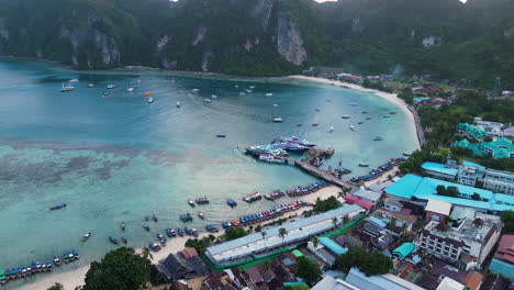 aerial circling boats on coast of ko phi phi islands, thailand