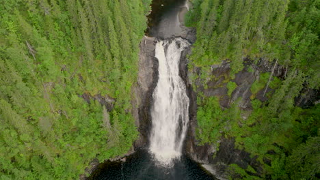 aerial drone view of storfossen waterfall with dense