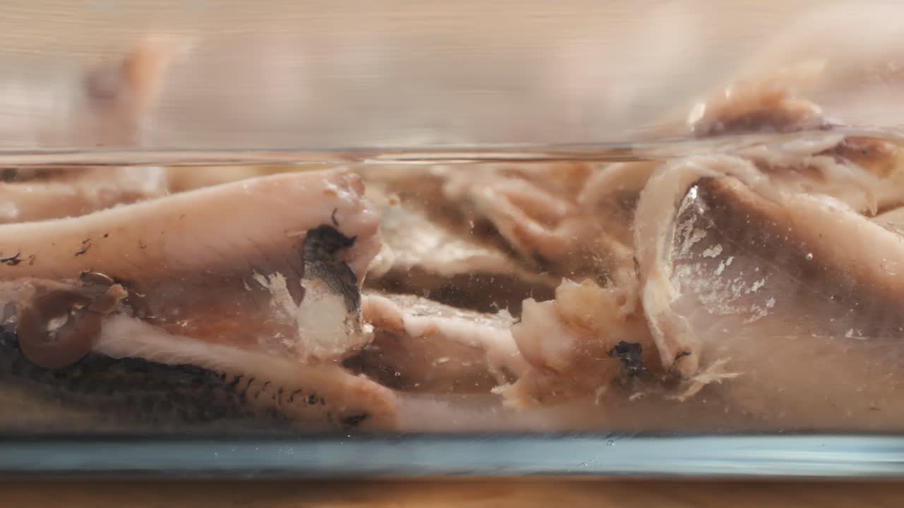 Fresh Sea sardines and Anchovy Fish and Mullus On Display On Ice On Market Store Shop. Seafood Fish Background, close up stand of small salty white fish.