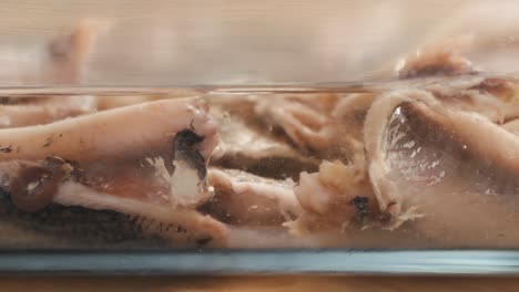 fresh sea sardines and anchovy fish and mullus on display on ice on market store shop. seafood fish background, close up stand of small salty white fish.