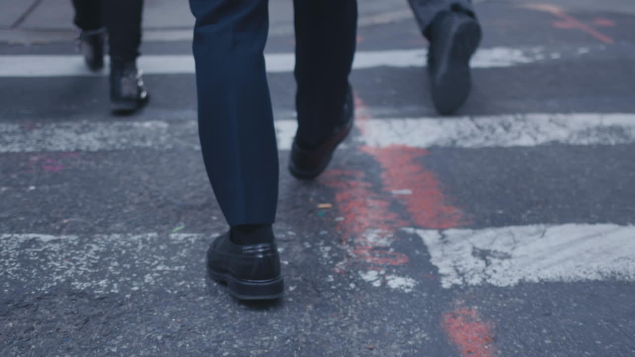 Pedestrians cross a city street
