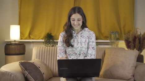 Young-woman-watching-movie-on-laptop-at-night.