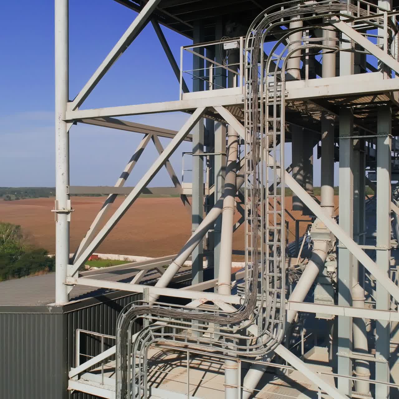 Granary grain elevators. Metal tanks for the storage crop. Large bins for farming