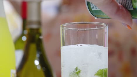 lady making mojito at a fancy art exhibit event