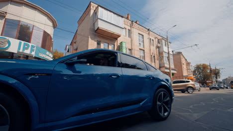 audi drives through the city streets. beautiful audi rides through the city
