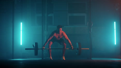 Athletic-Shirtless-Man-Training-Doing-Power-Strength-and-Endurance-Exercises-with-Barbell.-Workout-in-the-Hardcore-Gym-in-slow-motion