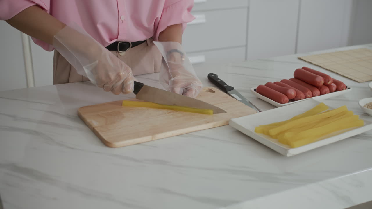 Anonymous Woman Cutting Radish for Dish at Kitchen Counter