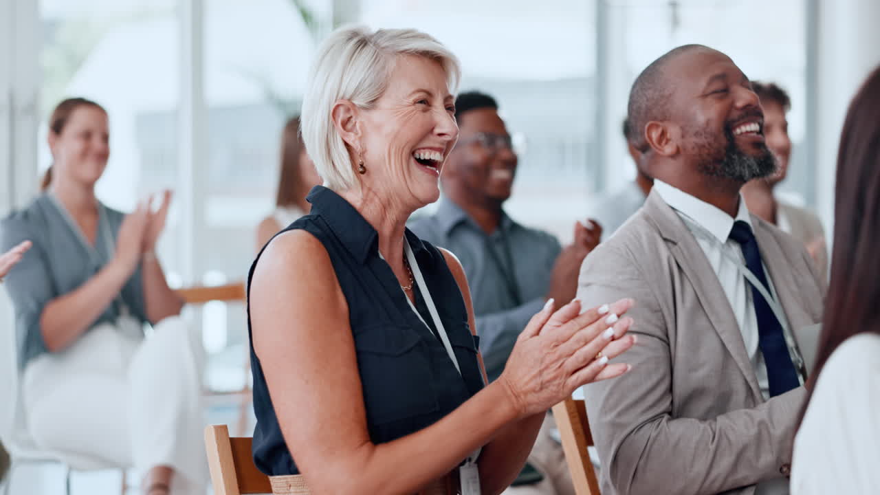 Diverse Business People Clapping and Laughing at a Conference