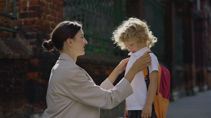 Mother helping her son get ready for school