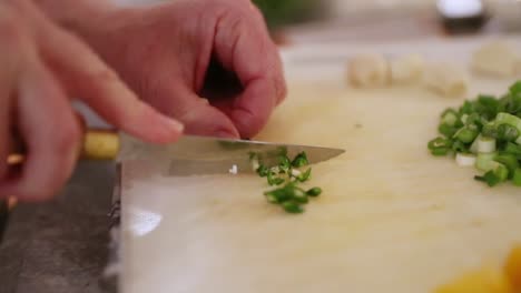 Close-Up-Of-Woman-Cutting-Chili-Pepper-In-Slow-Motion