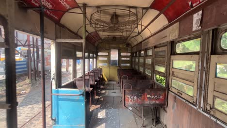 inside an old, rusty tram in kolkata, india
