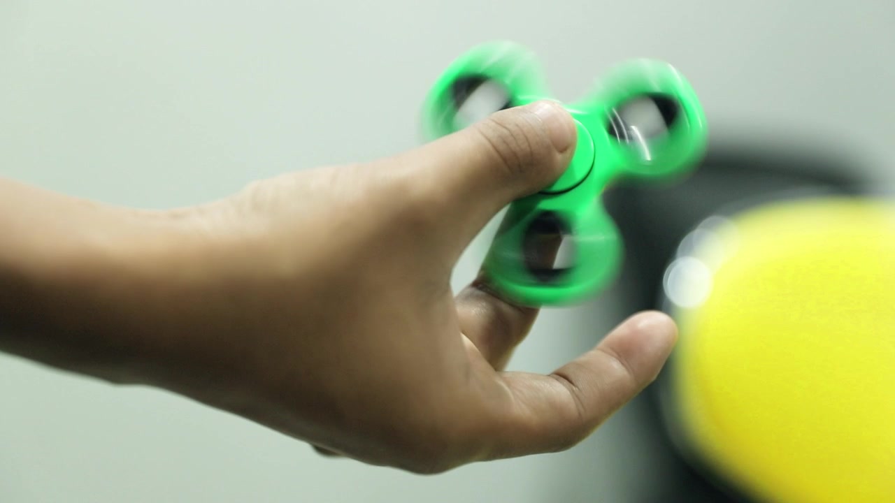 Playing With Fidget Spinner Slow Motion Shot Popular Toy.