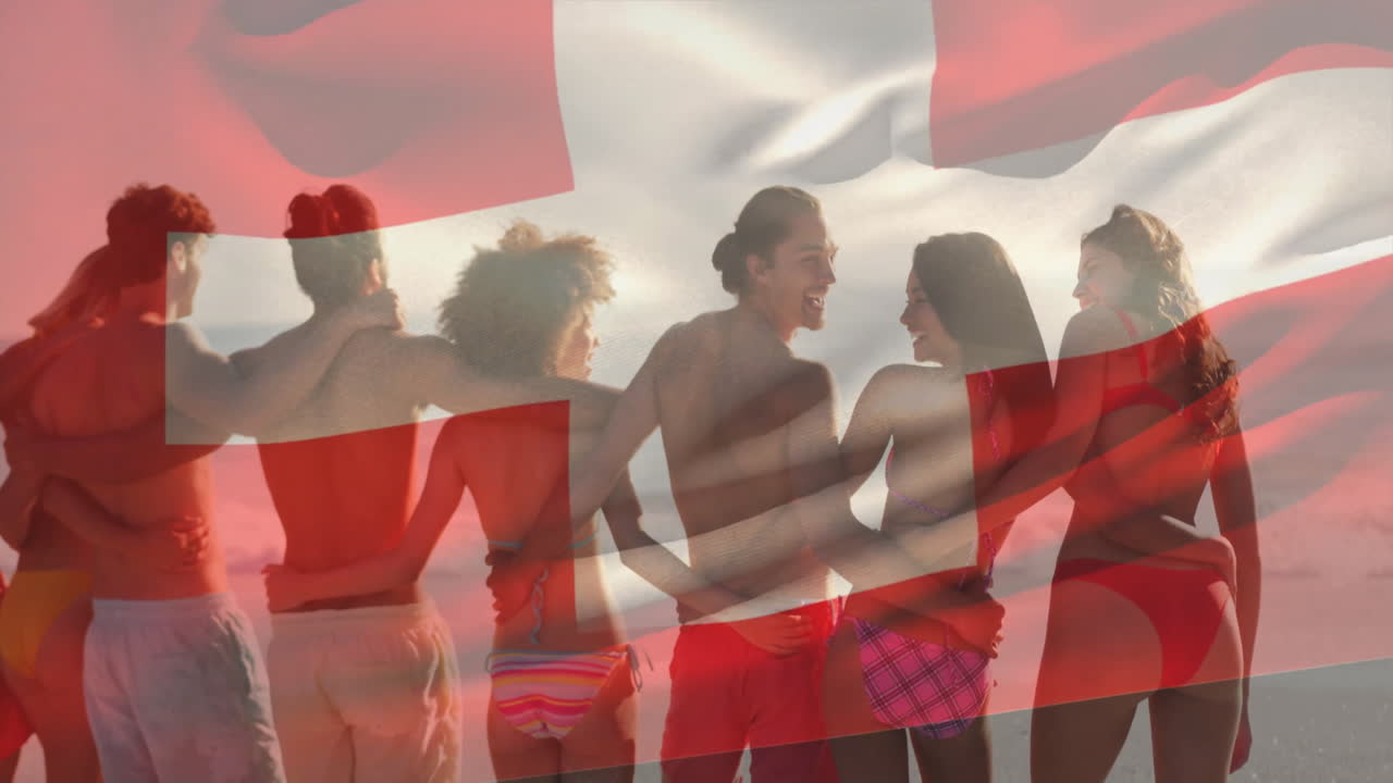 Holding Swiss flag, friends in swimwear posing together at beach, enjoying summer