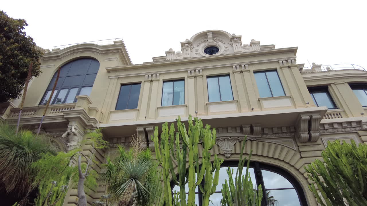 Low angle view of the Casino de Monte-Carlo with cacti at the bottom