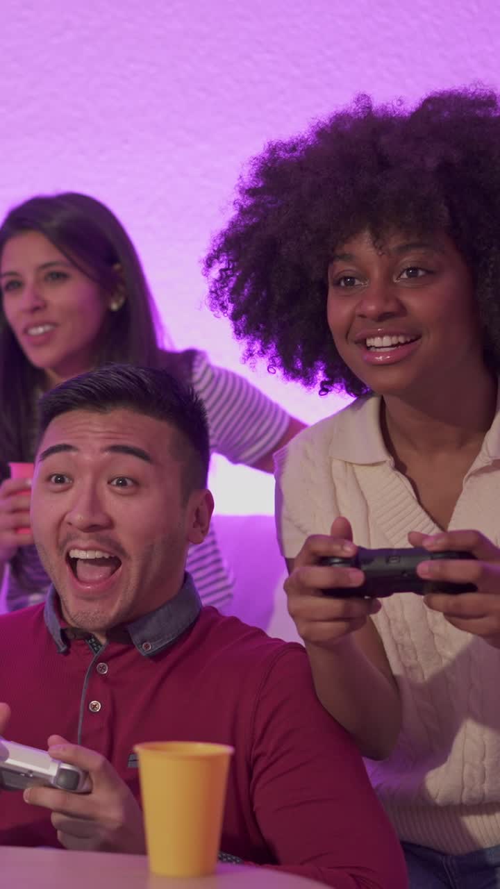 Friends Playing Video Games at a Party