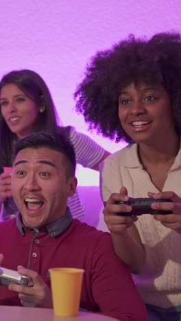 friends playing video games at a party