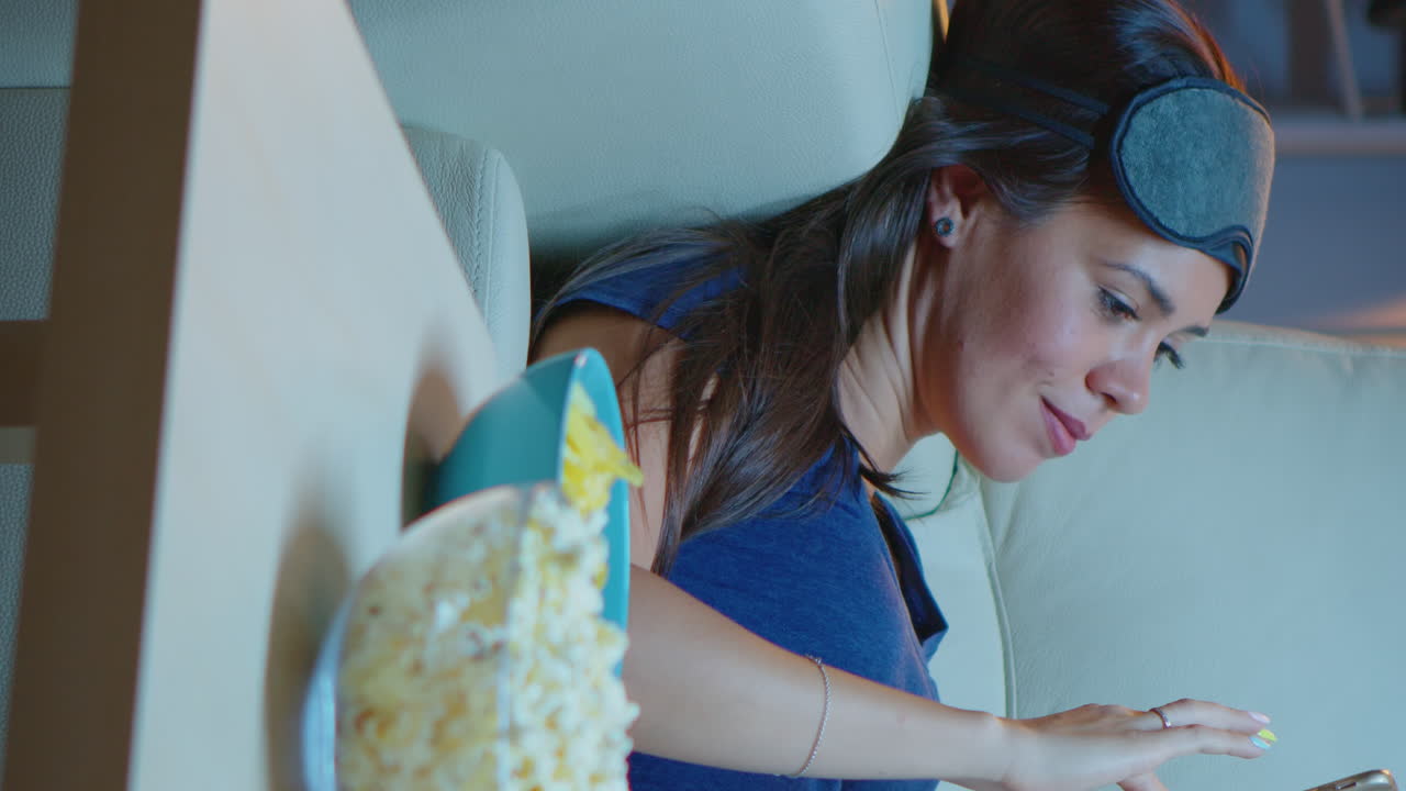 Vertical Video: Lady With Sleep Mask Searching On Phone