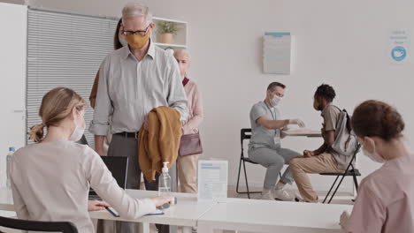 diverse people registering for vaccination