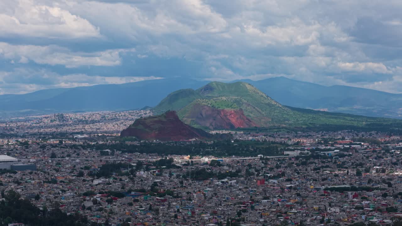 Telephoto drone view of volcanoes situated south of Mexico City