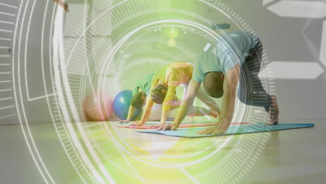 people doing yoga on mats with fitness data animation over them