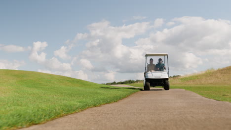 caucasian woman and african american man on the golf course.