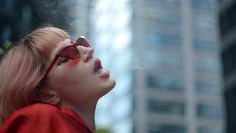 woman smoking in a cityscape