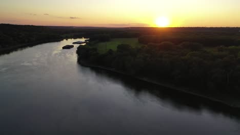 peaceful bridge with car traffic during sunset, aerial backward