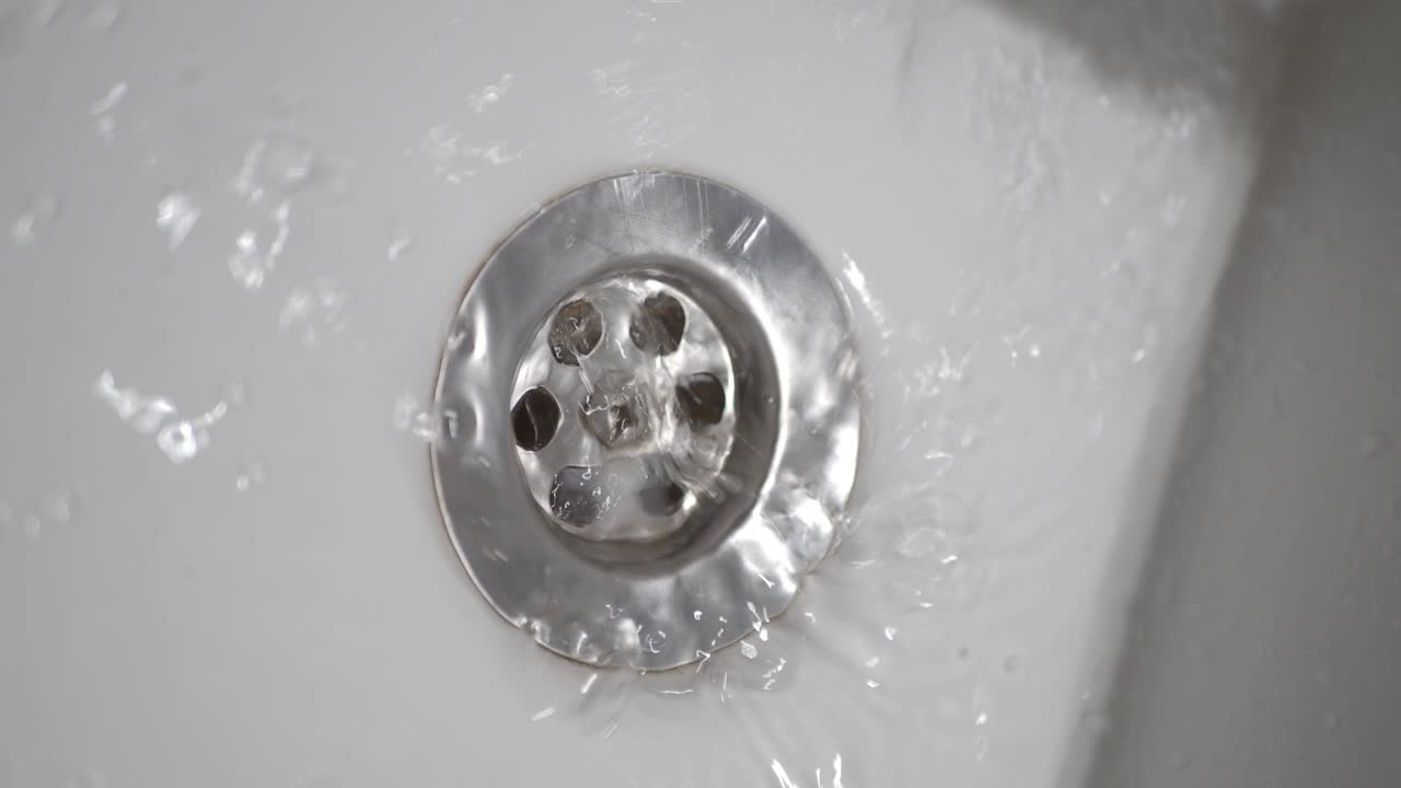 Water Draining into Sink Drain