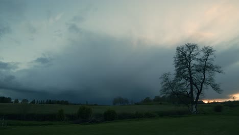 summer storm clouds approaching in evening dusk with rain