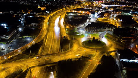 an aerial view of a night time time-lapse, timelapse of the a50, a500 dual carriage way, motorway, high way in the heart of the midlands area of stoke on trent, staffordshire, english a road