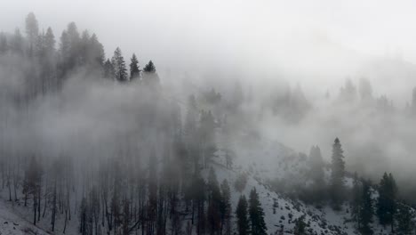 smoky clouds over winter mountains in boise national forest, idaho, united states