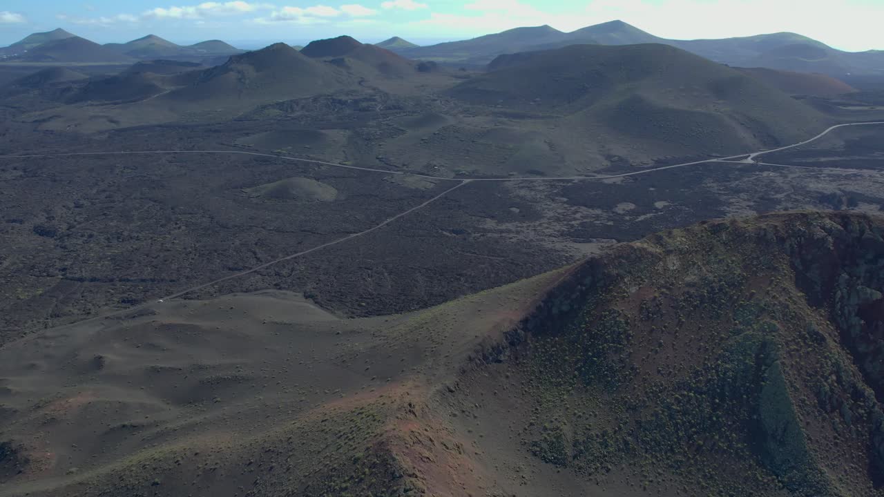 Aerial drone view of mountain sea and volcanoes in Lanzarote, Canary Islands, Spain