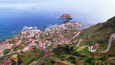 aerial panorama of coast city porto moniz in a lush green environment