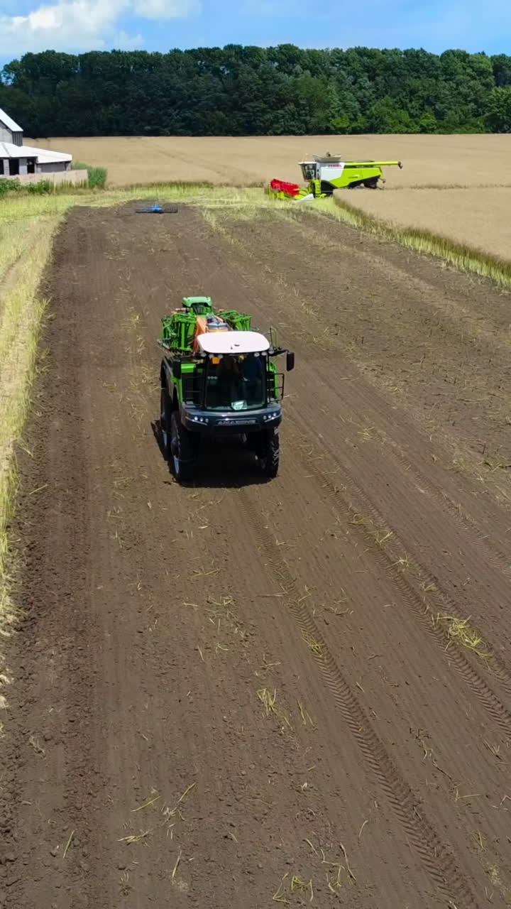 Self-Propelled Agricultural Sprayer. Self-propelled agricultural sprayer on a country field Vertical video