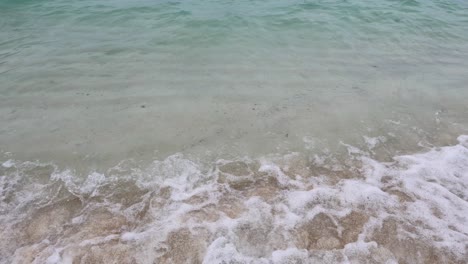 gentle waves lapping on a sandy shore