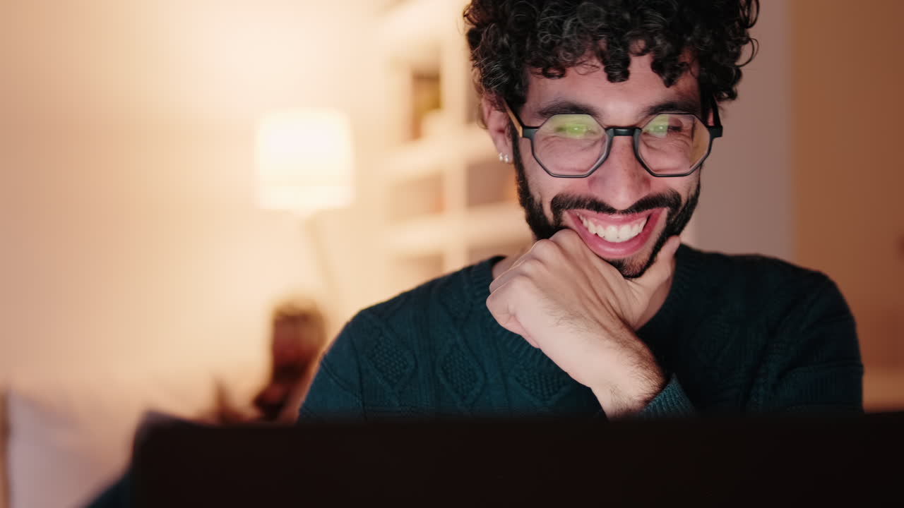 Gay Couple at Home Working on Laptop