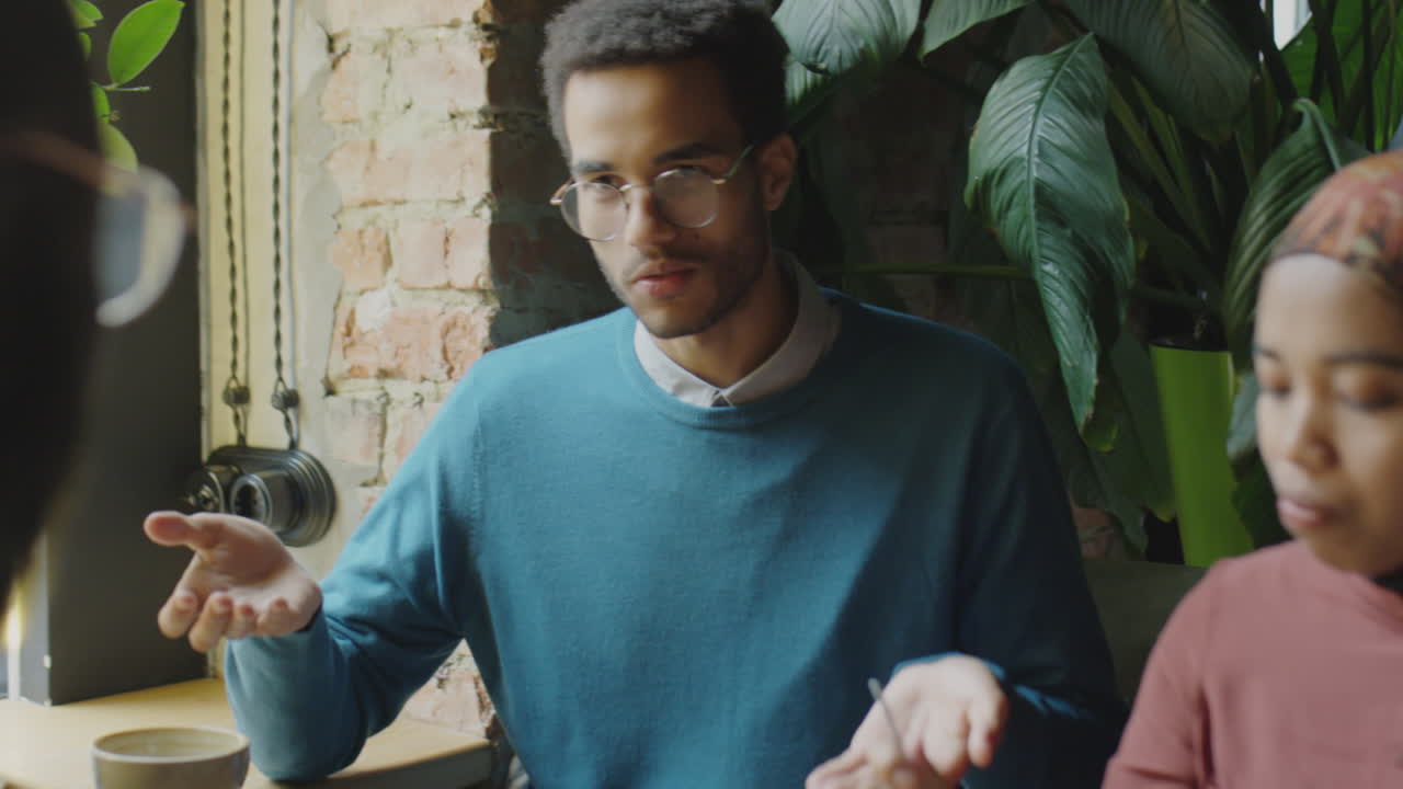 Diverse Business People Having Lunch in Cafe