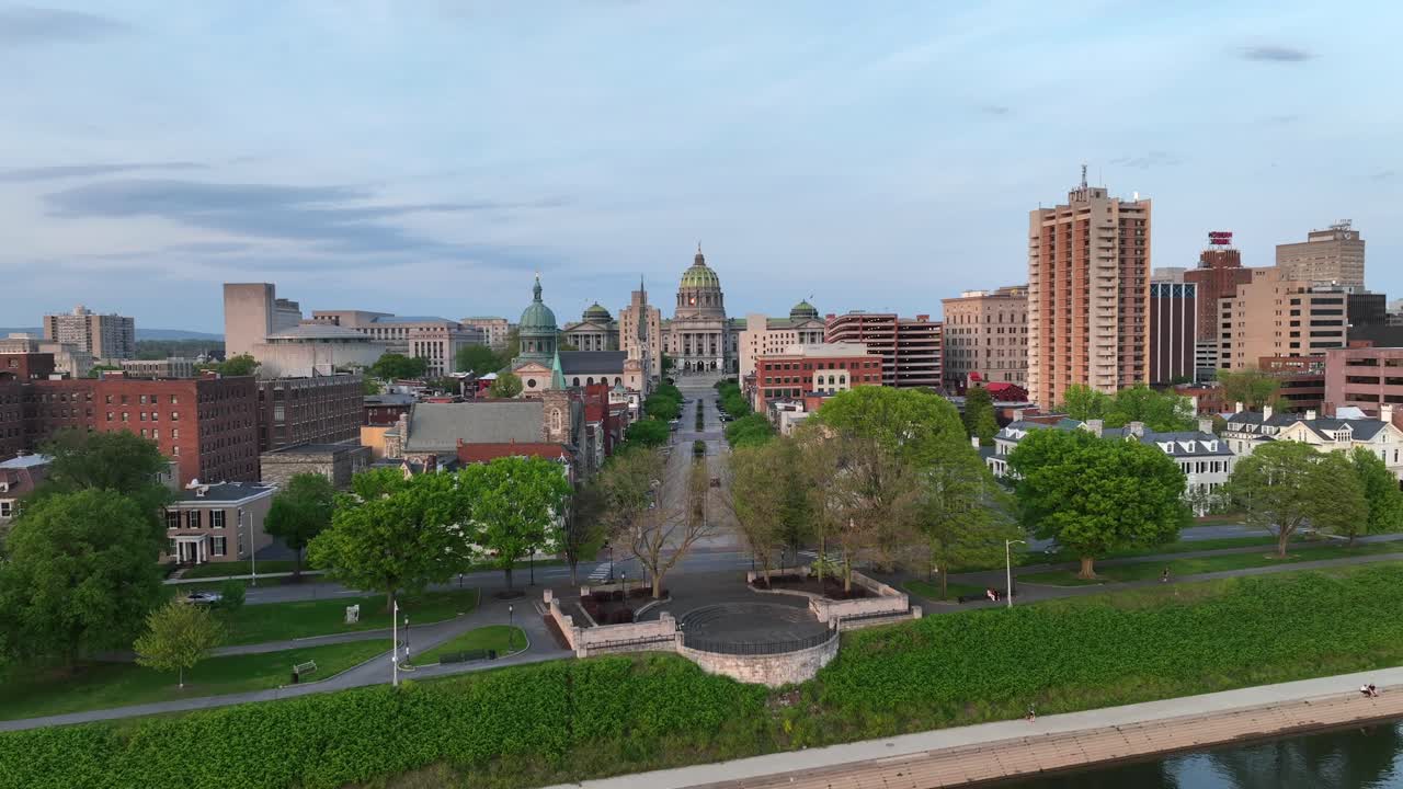 Aerial rising shot over Susquehanna River looking over State Street towards Pennsylvania capitol building