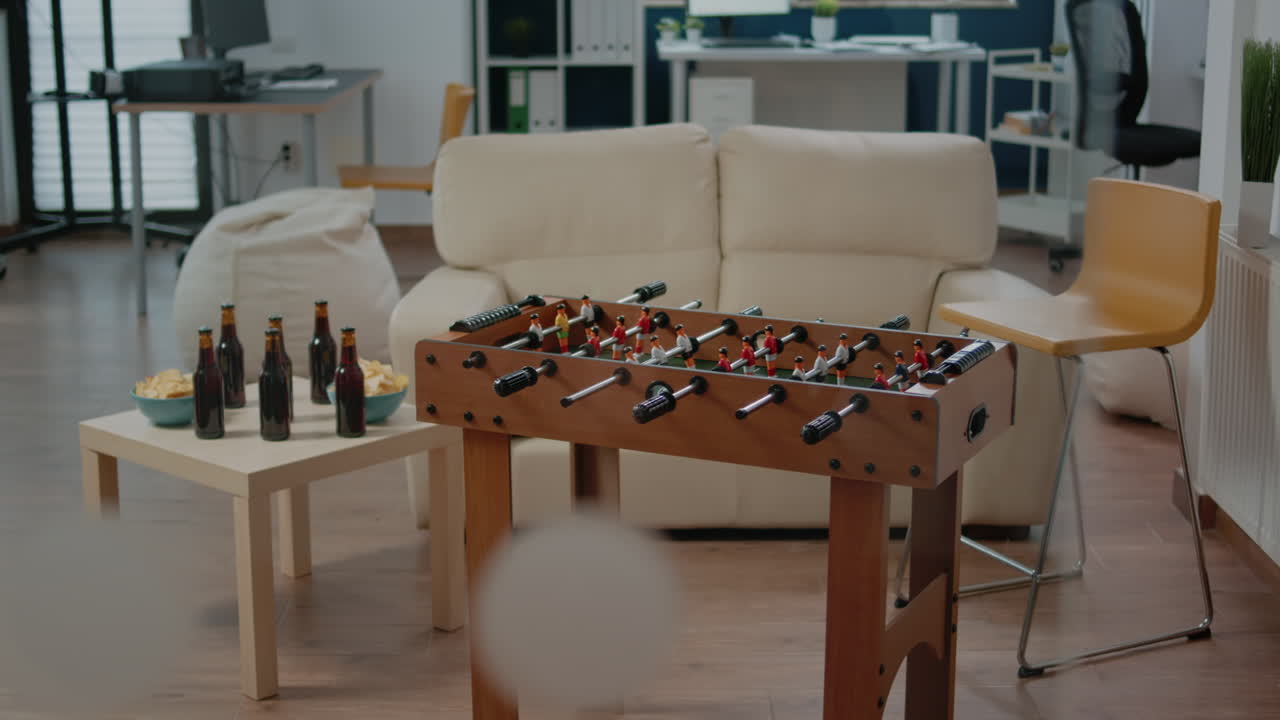 Nobody in office with foosball game table for party after work