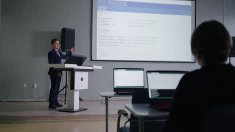 student presenting a coding project in a classroom