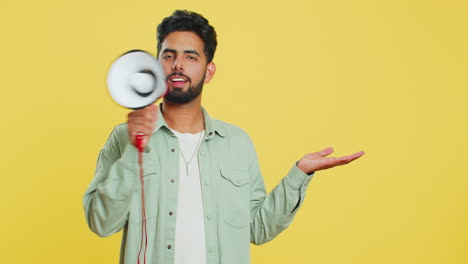 Indian-man-talking-with-megaphone,-proclaiming-news,-loudly-announcing-advertisement-discounts-sale