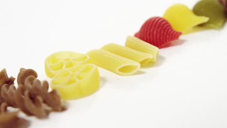 various pasta on white background